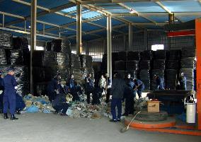 Police search warehouse of toxic waste exporter to Philippines+